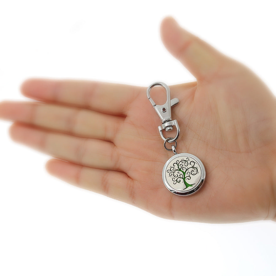 Wholesale Alloy Angel Wings Hollow Aromatherapy Essential Oil Keychain